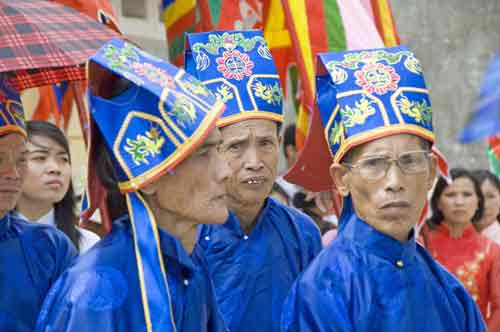 men in blue hats-AsiaPhotoStock