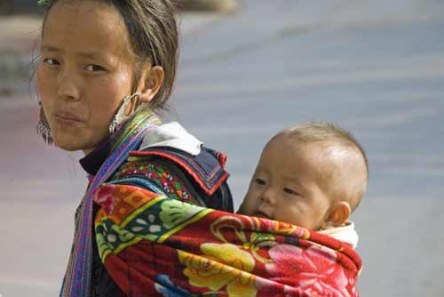 hmong child carrying-AsiaPhotoStock