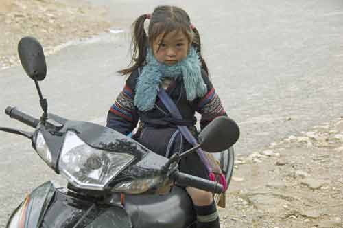 girl on motor bike-AsiaPhotoStock