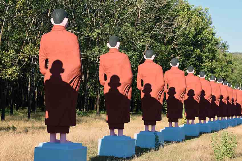shadows and monk statues-AsiaPhotoStock