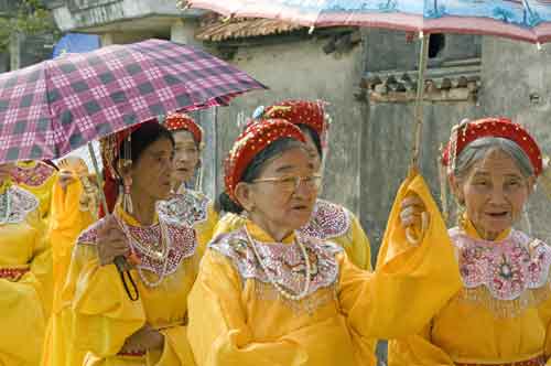 ladies in yellow-AsiaPhotoStock