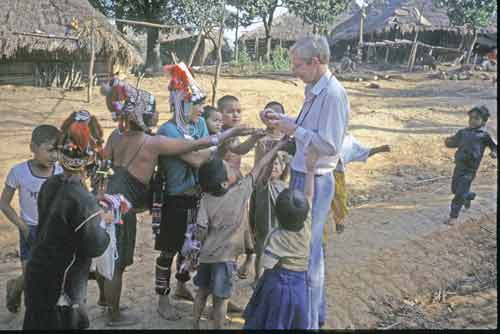 akha tribe with visitor-AsiaPhotoStock