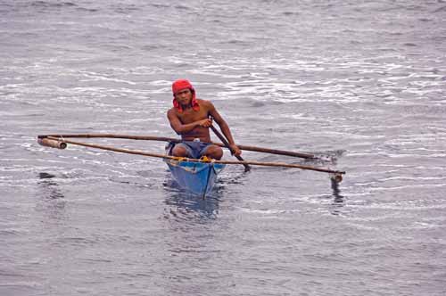 boatman in blue boat-AsiaPhotoStock