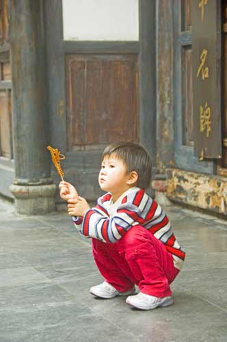 boy with candy-AsiaPhotoStock