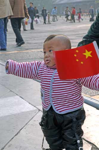 boy with haircut and flag-AsiaPhotoStock