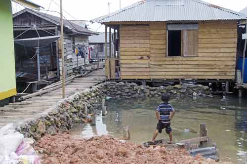 boy in village-AsiaPhotoStock