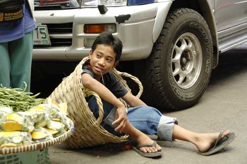 boy in a basket-AsiaPhotoStock