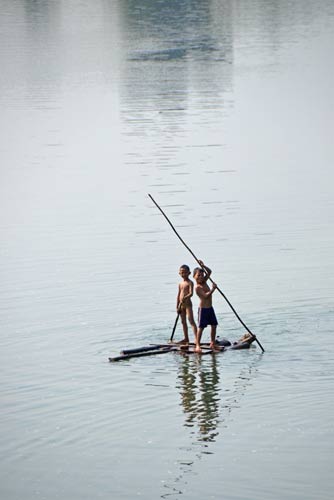boys on a raft-AsiaPhotoStock