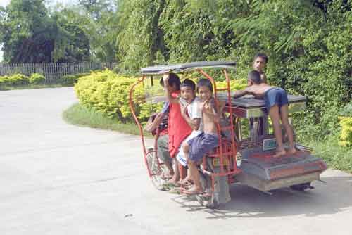 boys on a tricycle-AsiaPhotoStock