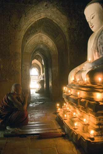 candles monk-AsiaPhotoStock