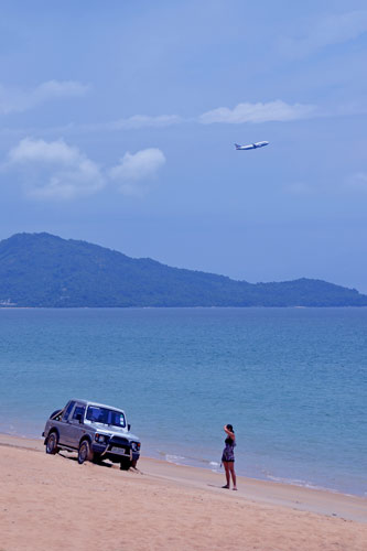 car on maikhao beach-AsiaPhotoStock