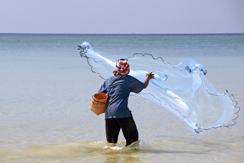 casting fish net-AsiaPhotoStock