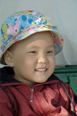 child with hat-AsiaPhotoStock