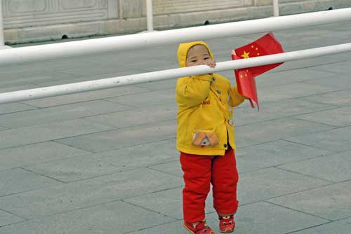 standing tall with flag-AsiaPhotoStock