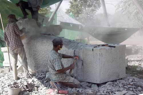 chiseling stone-AsiaPhotoStock
