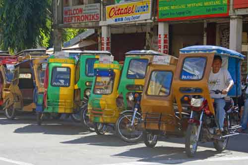 legaspi tricycles-AsiaPhotoStock