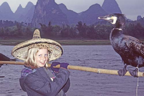 tourist and cormorant-AsiaPhotoStock