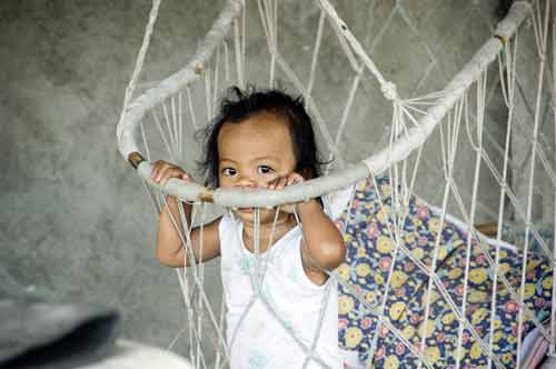 child in crib-AsiaPhotoStock