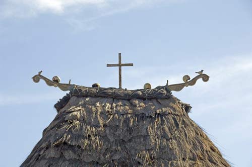 cross on thatch-AsiaPhotoStock