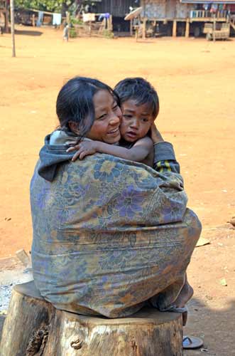 family in laos village-AsiaPhotoStock