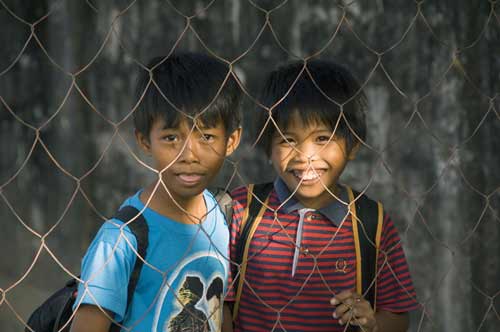 boys behind fence-AsiaPhotoStock