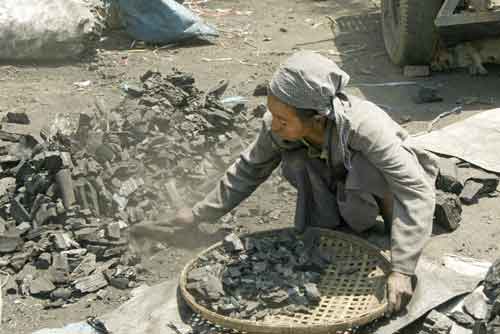 sieving charcoal-AsiaPhotoStock