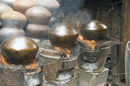 firing alms bowls-AsiaPhotoStock