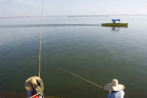 ladies with rods-AsiaPhotoStock