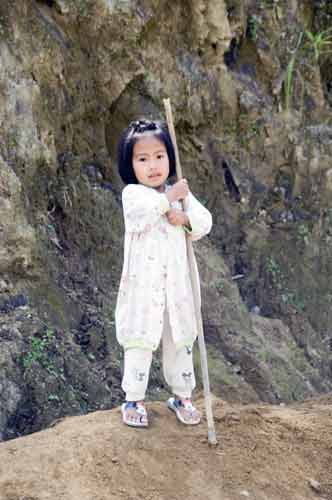 girl with stick-AsiaPhotoStock