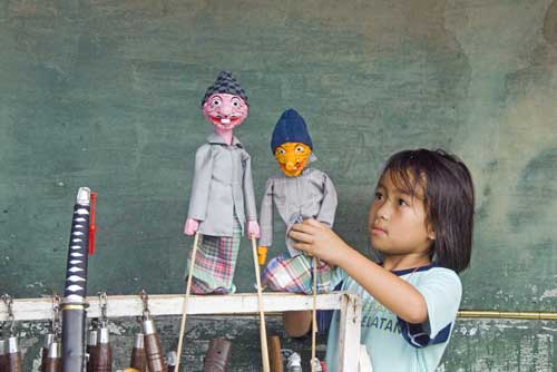 girl with puppets-AsiaPhotoStock