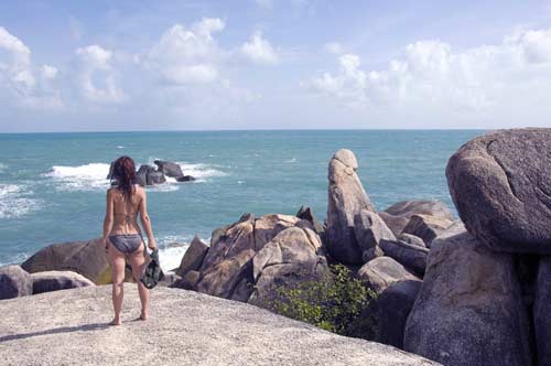 girl by phallic rock-AsiaPhotoStock