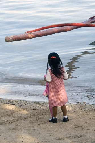 girl on beach looking-AsiaPhotoStock