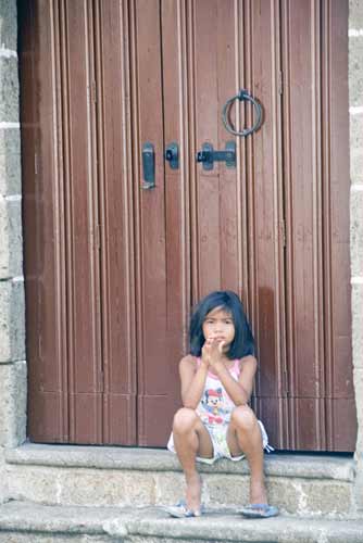 girl in doorway-AsiaPhotoStock