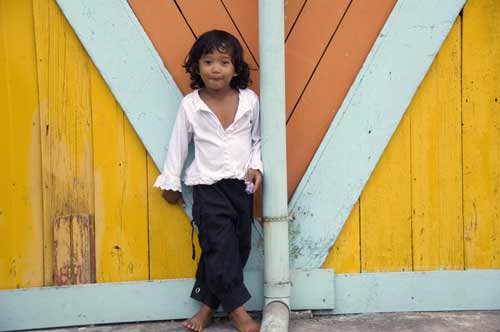 girl by yellow wall-AsiaPhotoStock