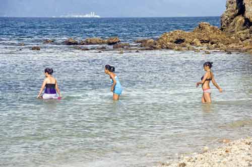 three girls wading-AsiaPhotoStock