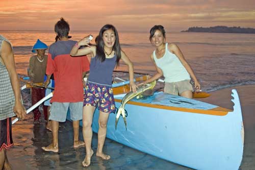 girls and fresh fish-AsiaPhotoStock