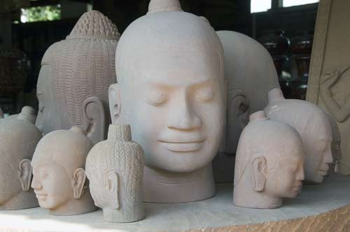 heads in sandstone-AsiaPhotoStock