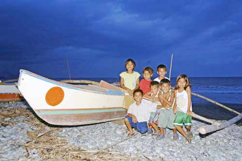 filipinos by a boat-AsiaPhotoStock