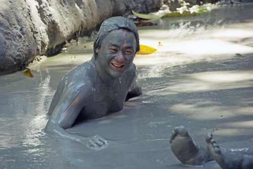 kim in mud bath-AsiaPhotoStock