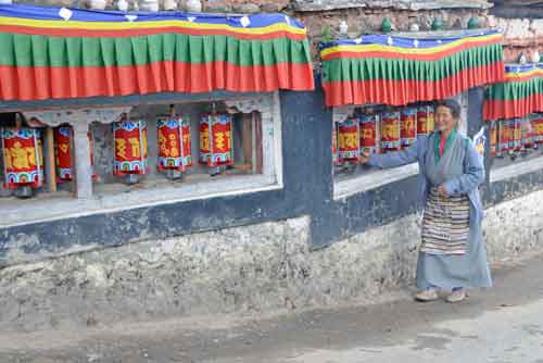 lady prayer wheel-AsiaPhotoStock