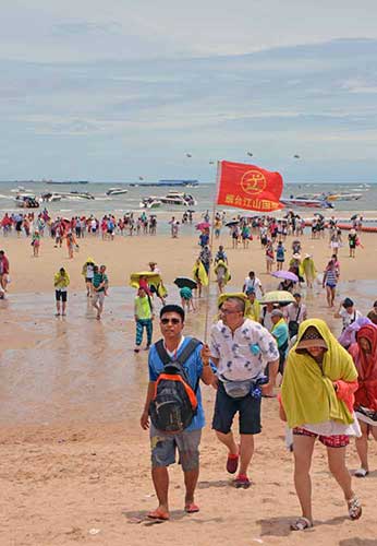 leader of beach tour-AsiaPhotoStock