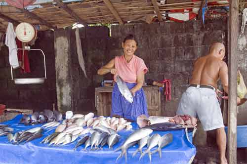 lady holding fish-AsiaPhotoStock