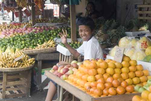 boy at fruit stall-AsiaPhotoStock