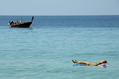 sunbathing on a lilo-AsiaPhotoStock