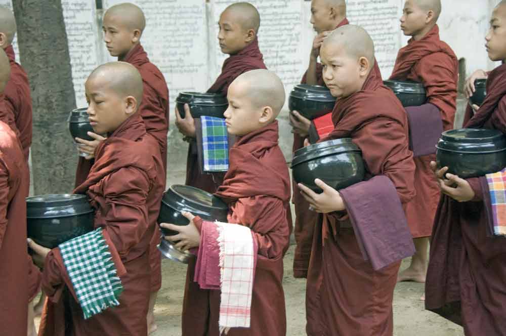 line of monks-AsiaPhotoStock