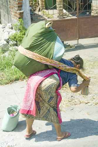 lady strapping on load-AsiaPhotoStock