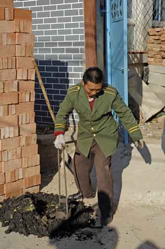 making bricks of coal-AsiaPhotoStock