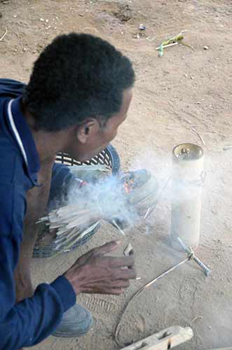 making fire in jungle-AsiaPhotoStock