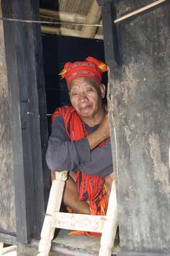 ifugao sitting in hut-AsiaPhotoStock