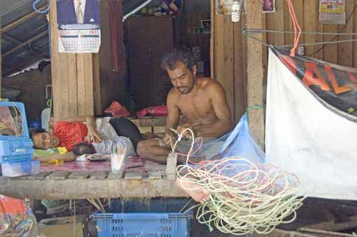 mending nets-AsiaPhotoStock